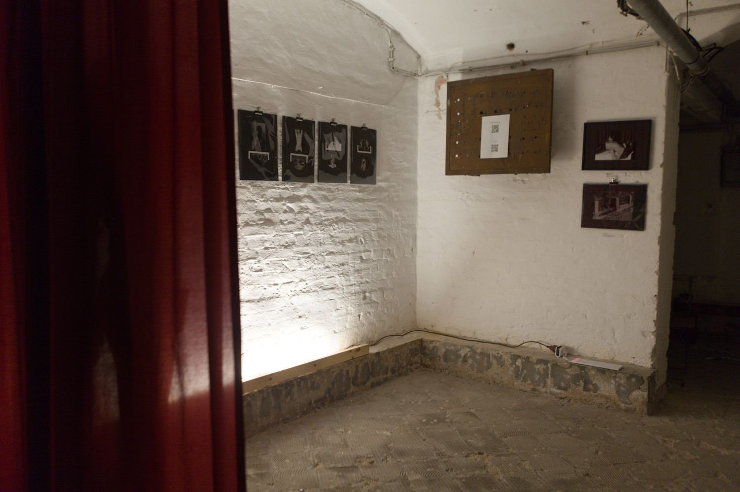 Installation view from photographic art exhibition at Pandora Art Gallery, Berlin, Germany. Photographs mounted on the wall, red curtain in the foreground.