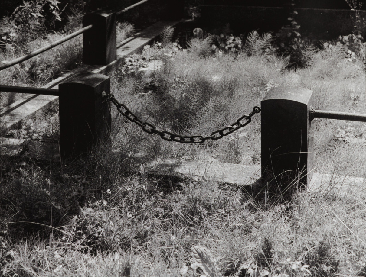 Omen II, Berlin by Johnny Welch. Photograph of a chained fence in a cemetery