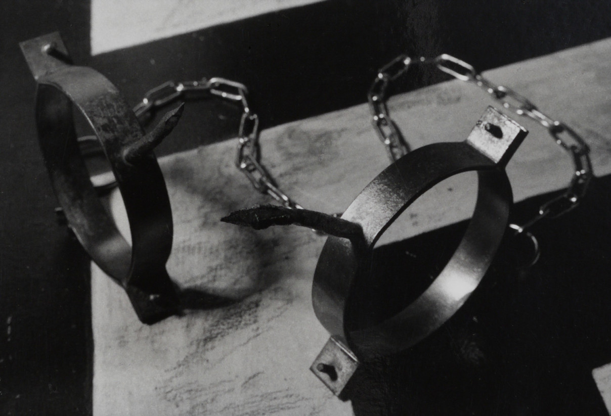 Shacles, Berlin by Johnny Welch. Photograph of two cast iron pieces linked together with chain