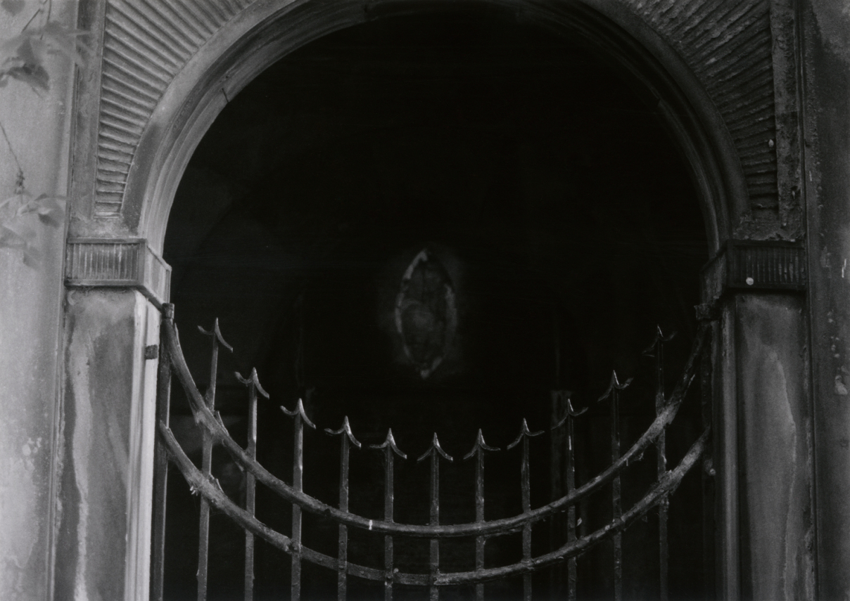 Gate Beyong the Garden, Edinburgh by Johnny Welch. Photograph of a circular gate at a cemetery